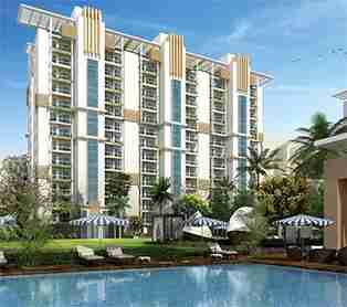 Front View of Raheja Vanya with pool view pool bed with pool umbrella with garden and palm trees 